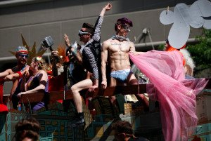 Revelers ride in a float during the gay pride parade in Salt Lake City, Utah, June 3, 2012. Over 300 active Mormons and more than 5,000 members of the Lesbian, Gay, Bisexual and Transgender (LGBT) community with their supporters marched in the parade as part of the Utah Pride Festival. REUTERS/Jim Urquhart (UNITED STATES - Tags: SOCIETY) ORG XMIT: SLC07