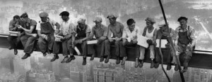 29 Sep 1932, Manhattan, New York, New York, USA --- Construction workers eat their lunches atop a steel beam 800 feet above ground, at the building site of the RCA Building in Rockefeller Center. --- Image by © Bettmann/CORBIS
